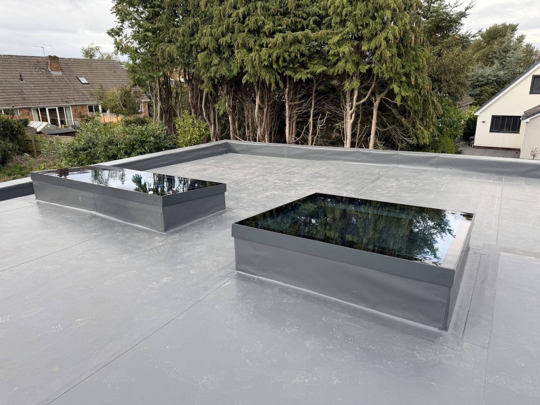 Two Infinity framed flat rooflights on a modern flat roof