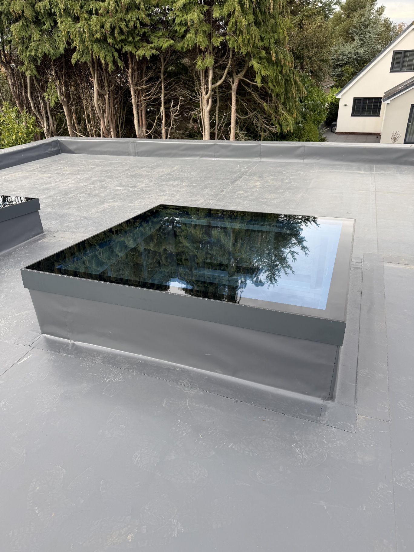 Infinity framed flat rooflight viewed from above on a flat roof
