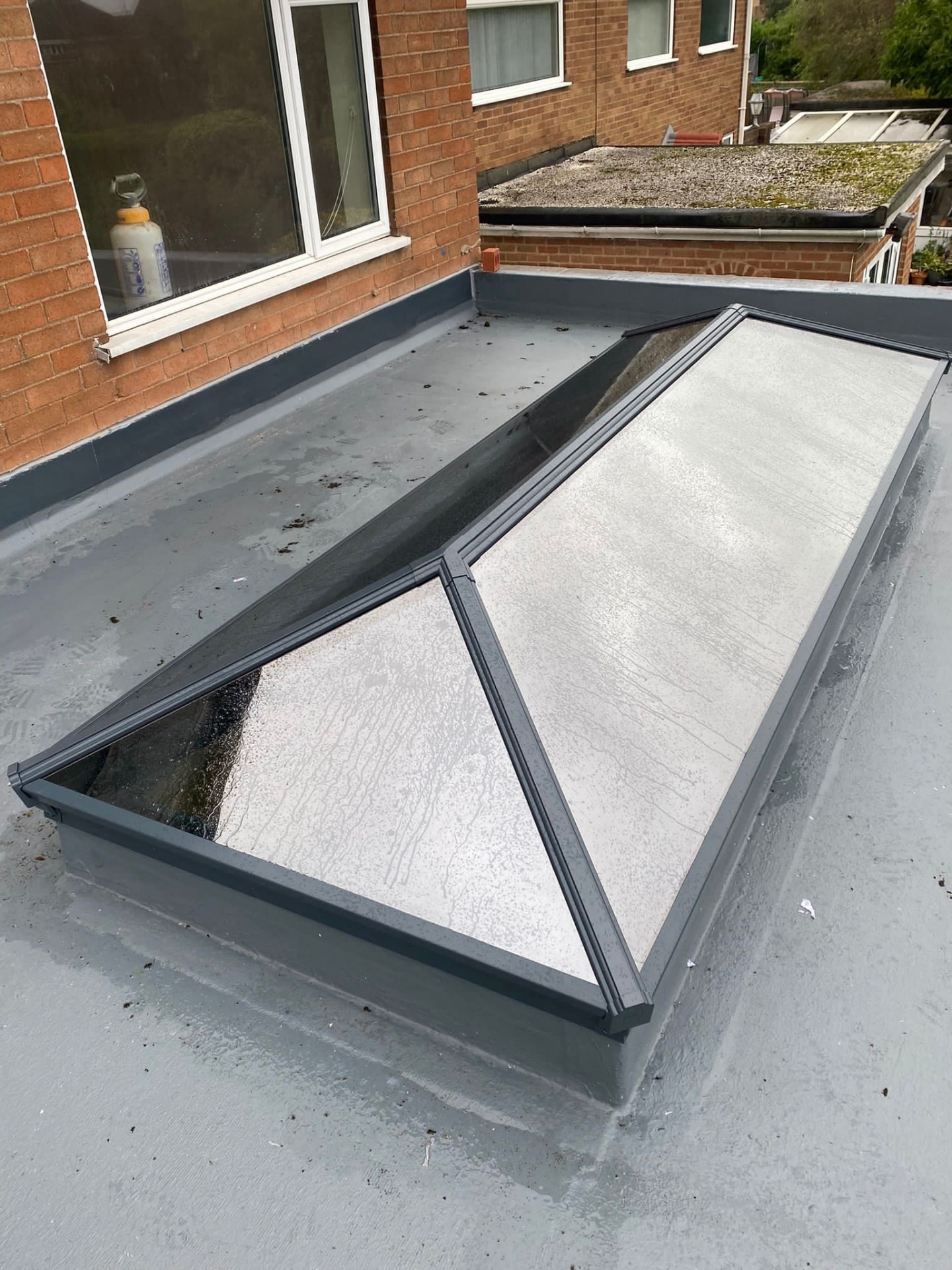 Close view of a large grey Korniche roof lantern