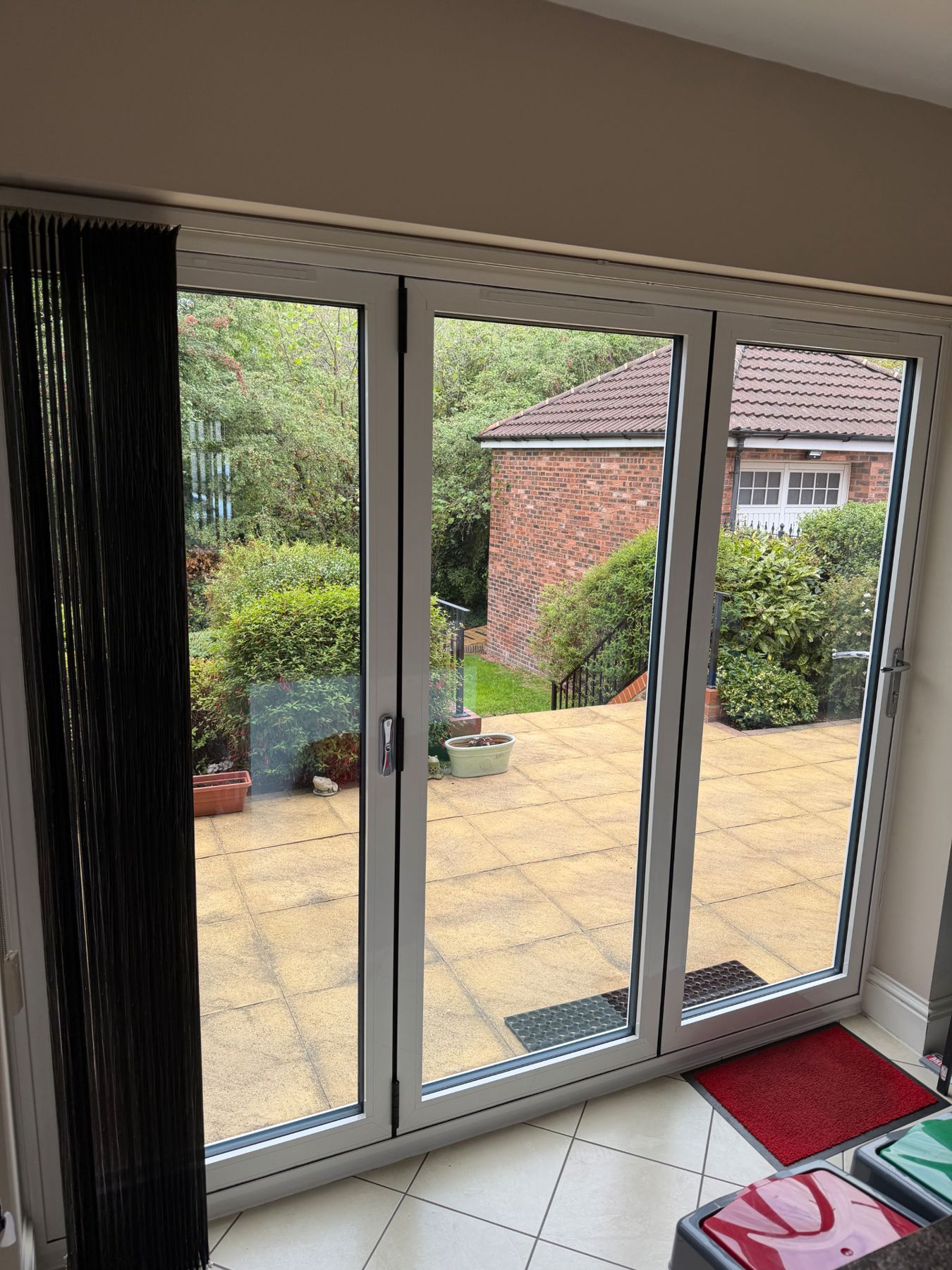 Internal view of white aluminium bifold doors installed in Hull