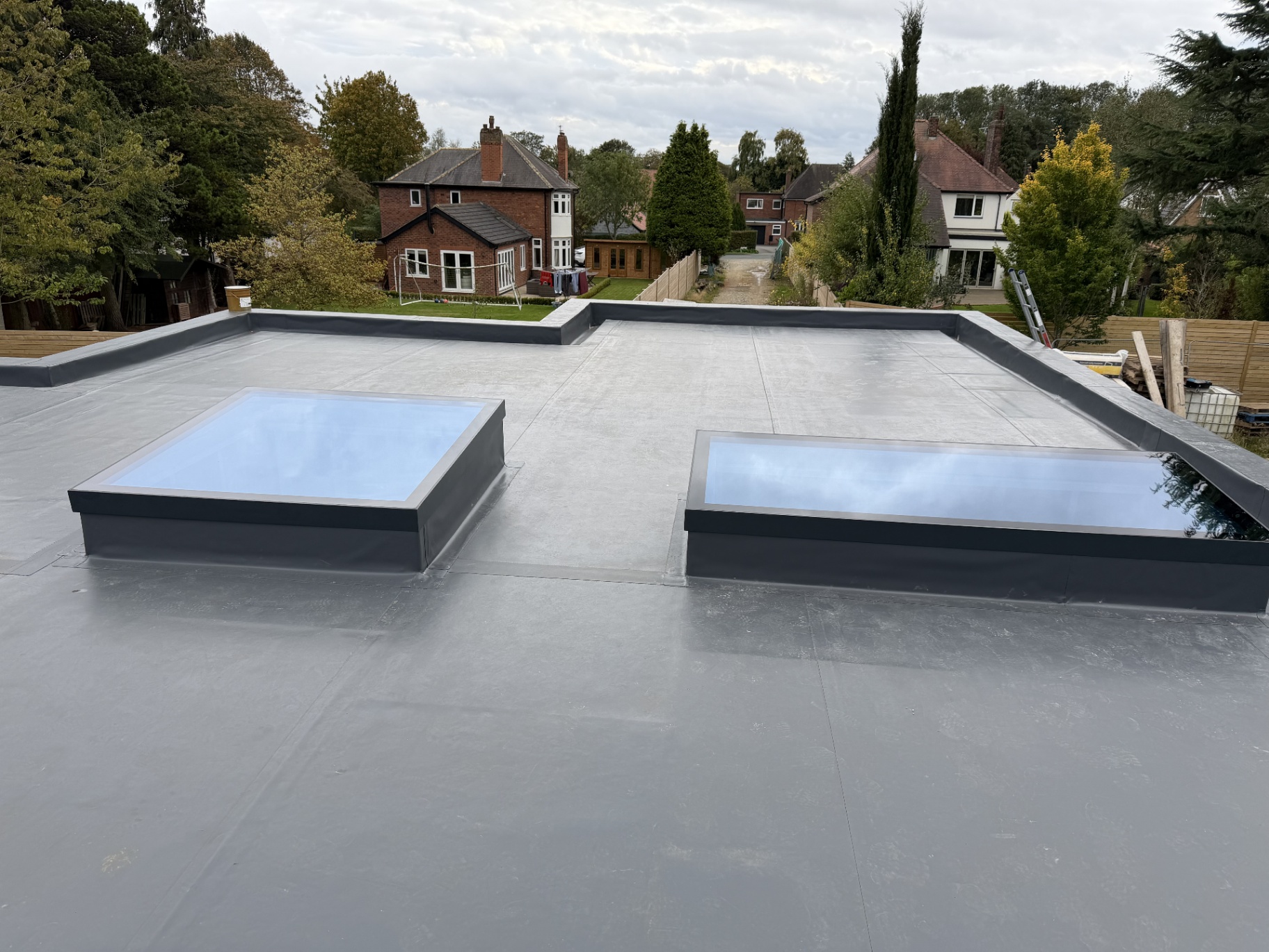 Flat rooflights and roof lanterns across a large extension roof