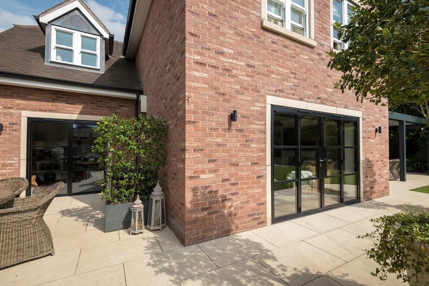 Origin aluminium bifold doors in a brick rear extension