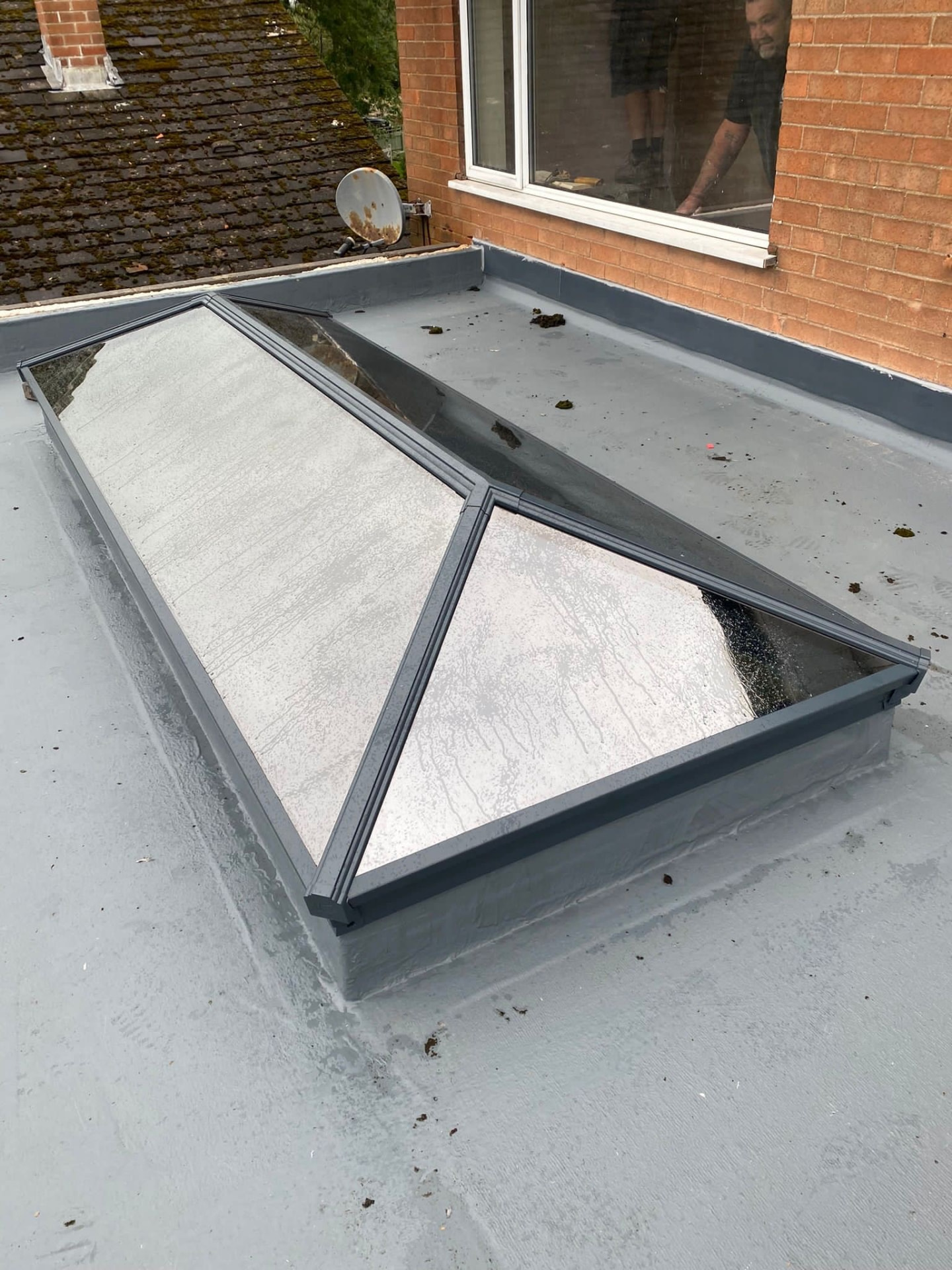 Grey Korniche aluminium roof lantern installed on a flat roof