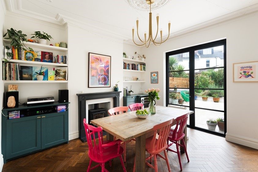 Origin steel-look aluminium French doors leading from a dining space to the garden