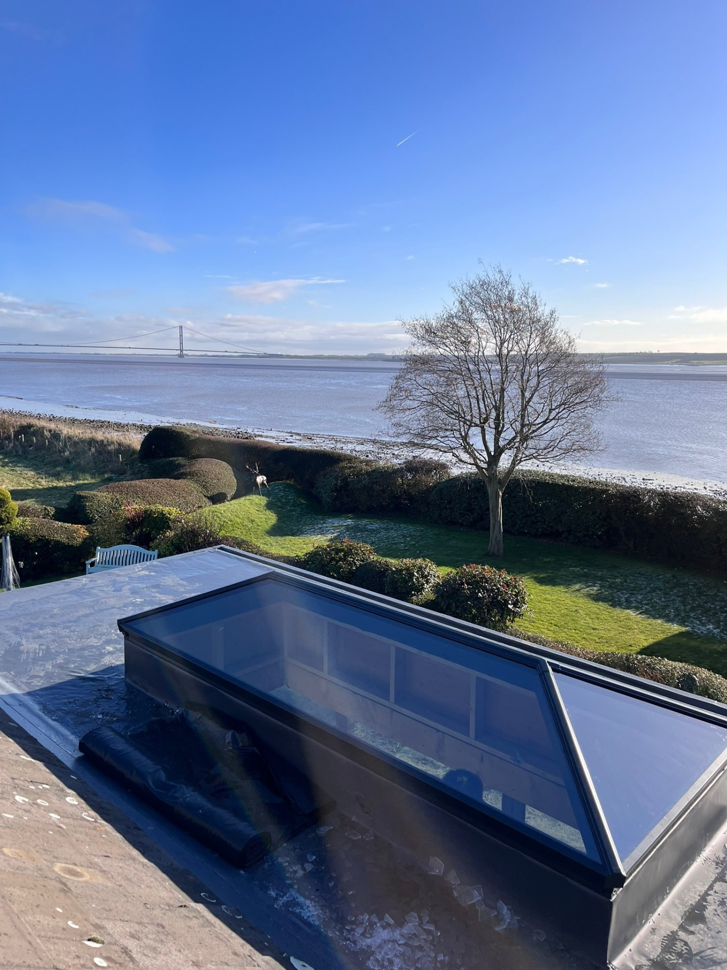 High-level view of the Humber Bridge from a flat roof fitted with a Korniche lantern