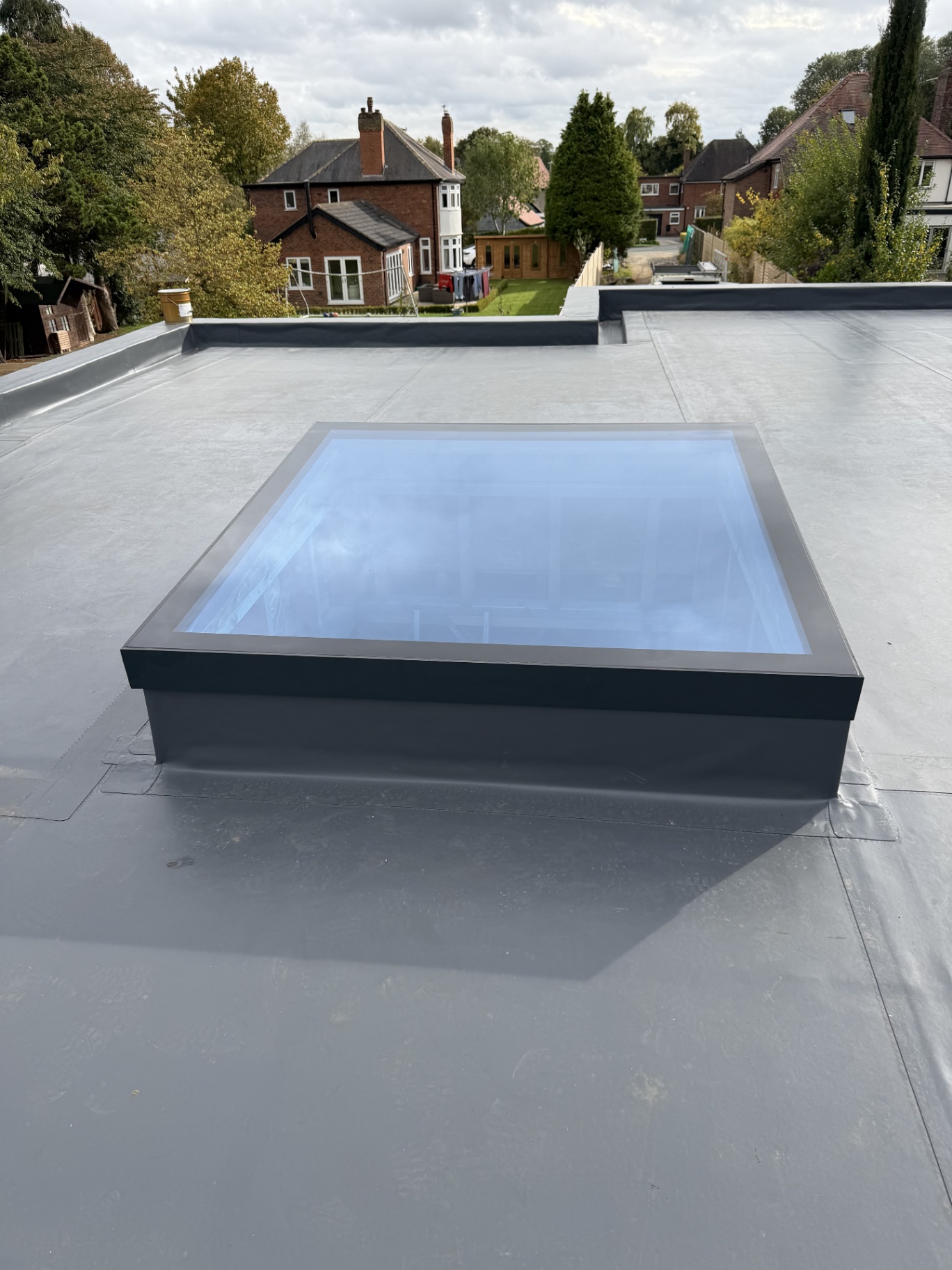 Square Infinity framed flat rooflight reflecting the sky