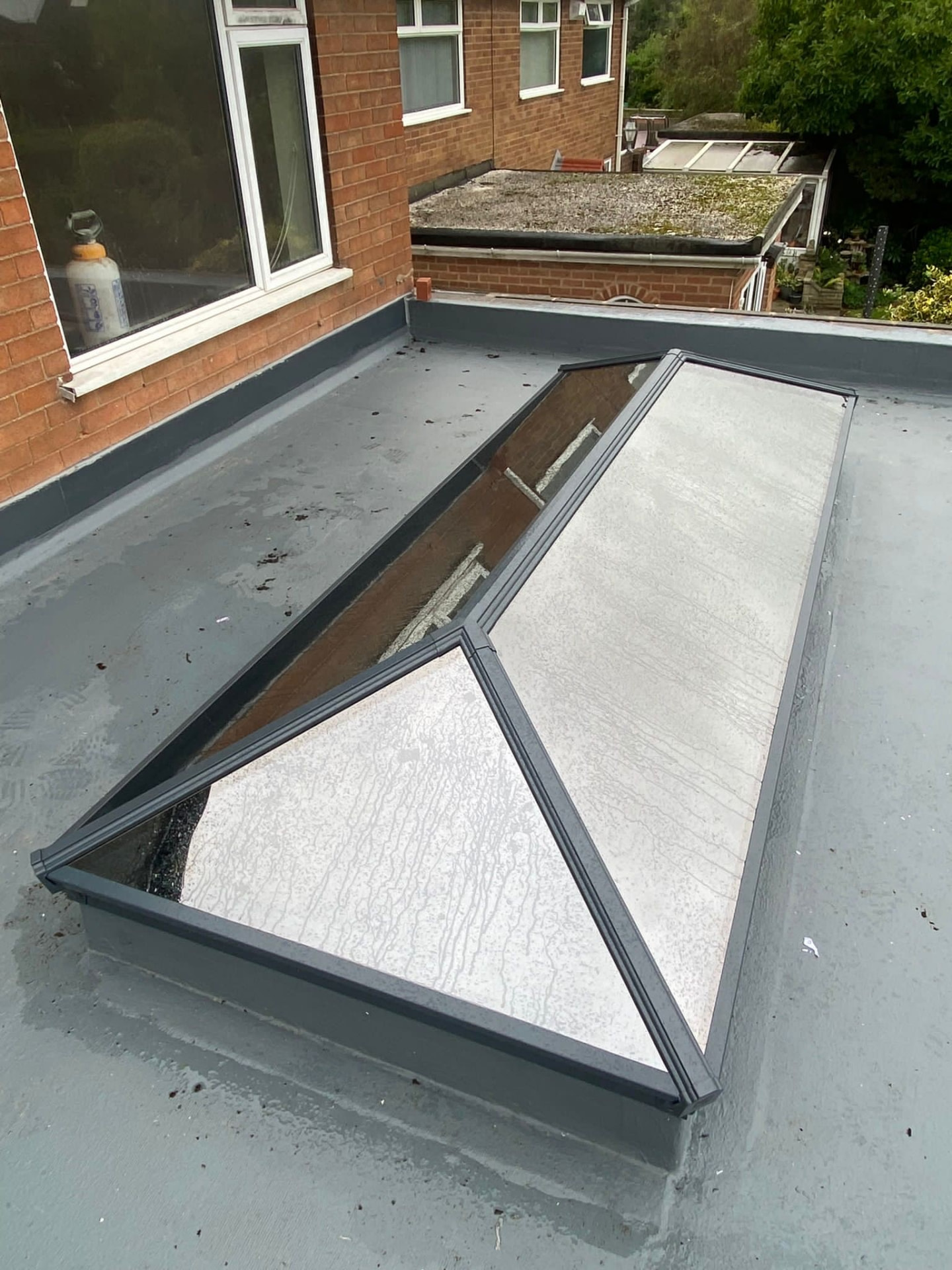 Korniche roof lantern being installed on a flat roof