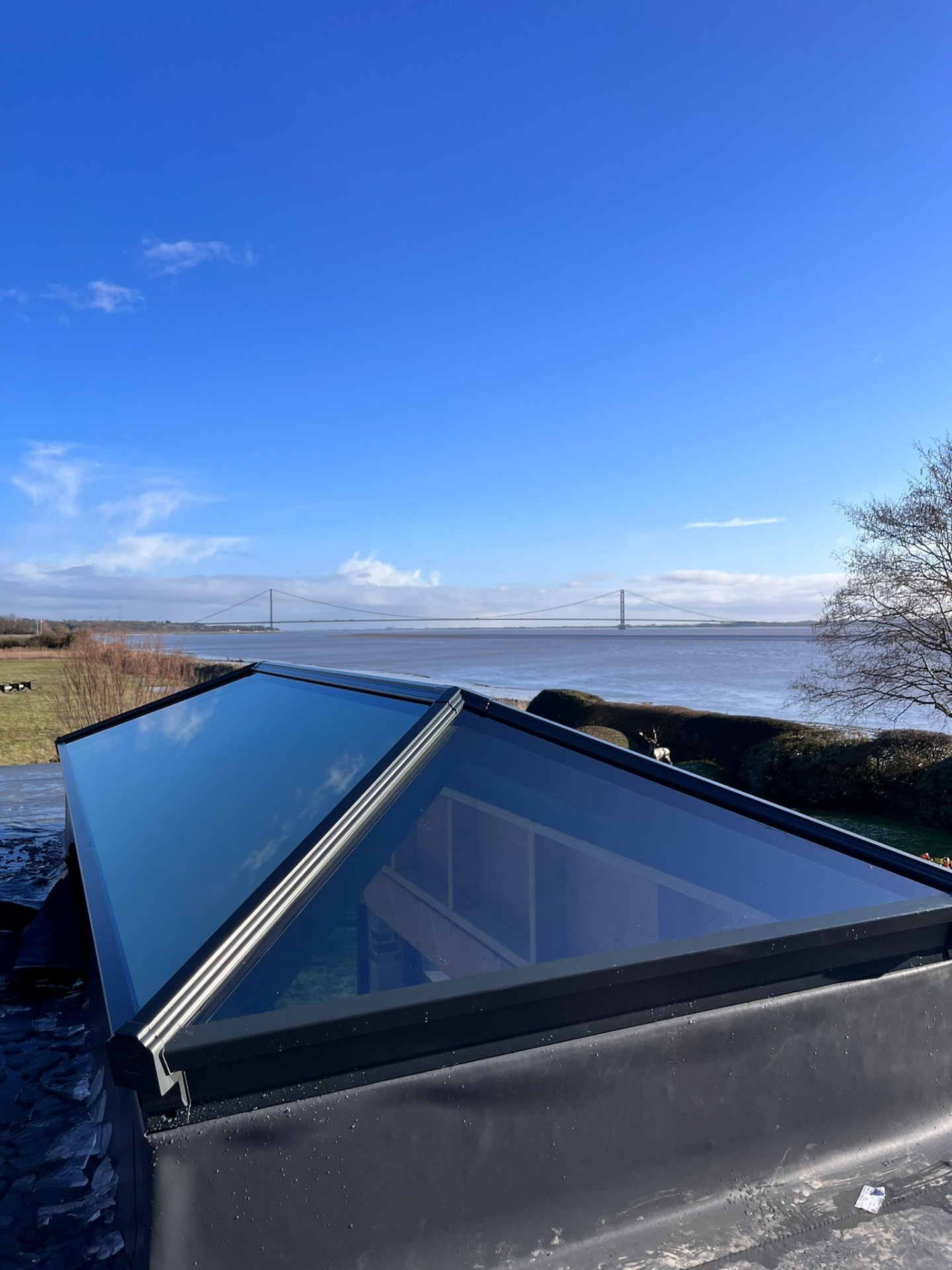 The Humber Bridge seen through the glazing of a newly installed Korniche roof lantern