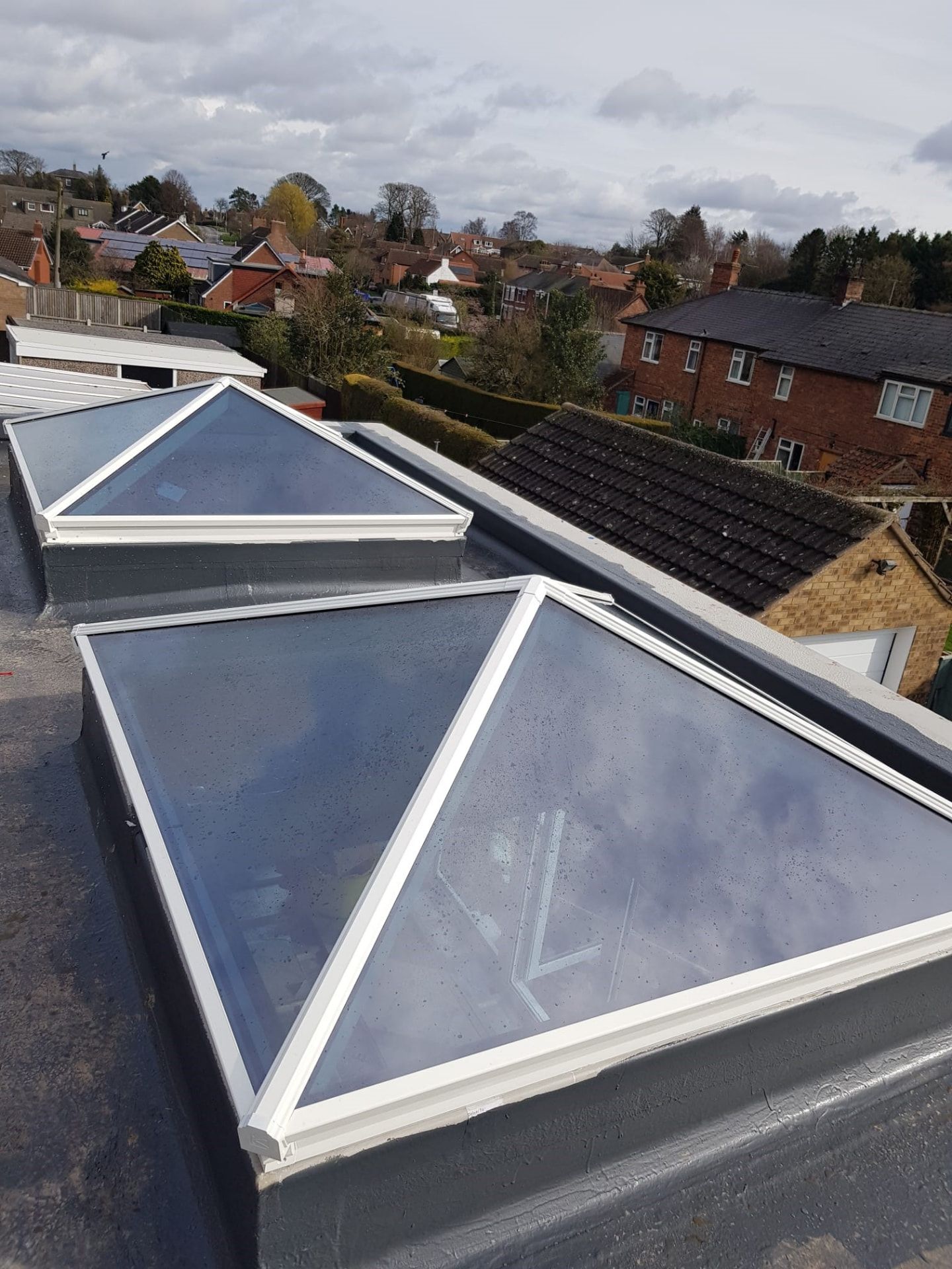 Two large white Korniche roof lanterns installed side by side